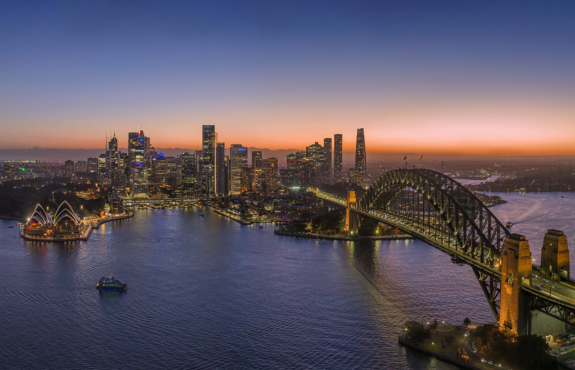 The Sydney skyline, Opera House and Harbour Bridge at dusk